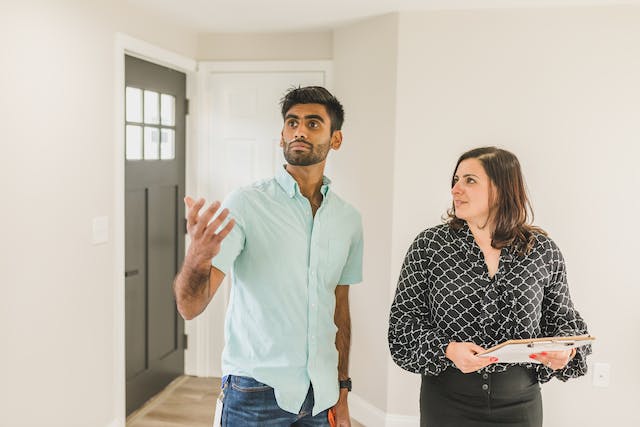 a landlord in a black shirt conducting a property showing with a tenant