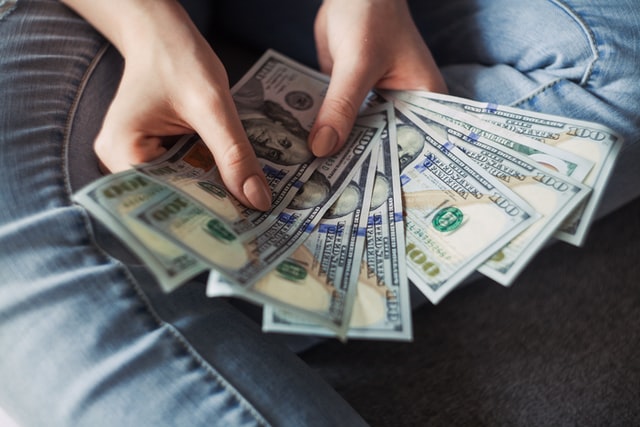 person holding a bunch of cash